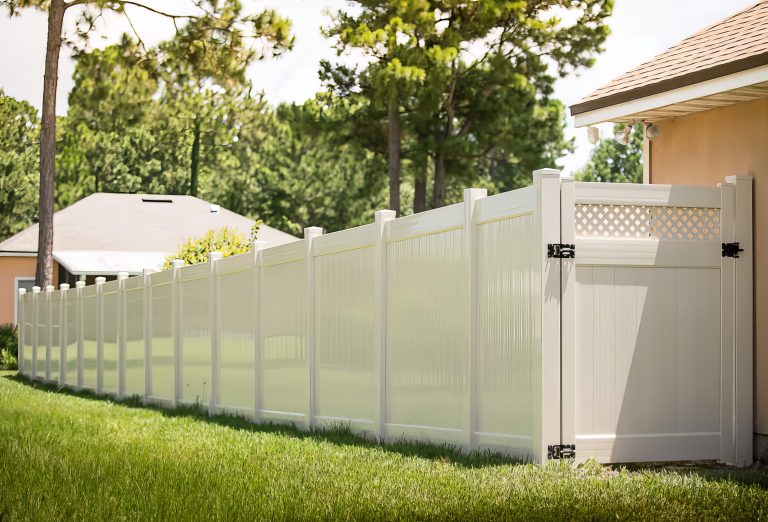 White vinyl privacy fence installed by Premier Outdoor Solutions, top-rated Flint Michigan fence contractor